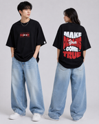 Two people wearing black t-shirts with text, one facing forward and the other facing backward, on a plain background.